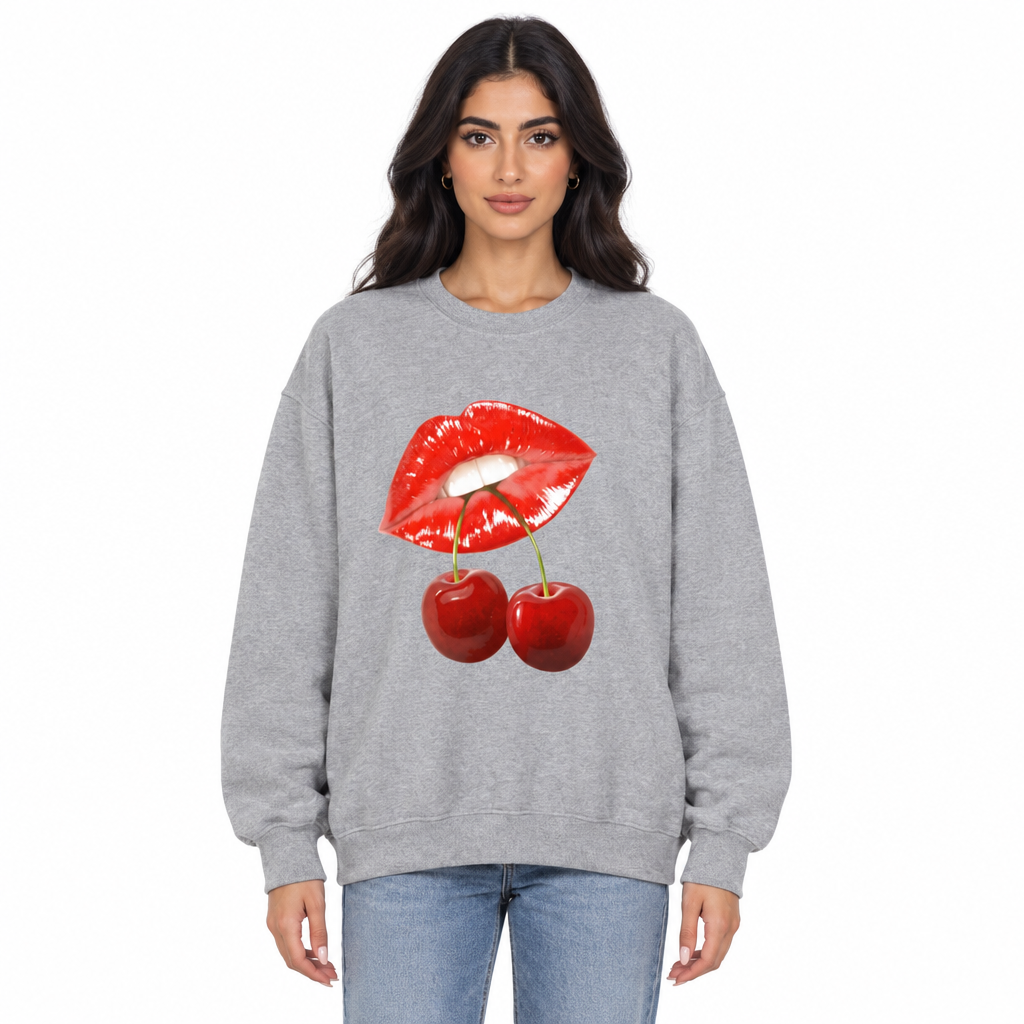 Front-facing model wearing the gray lips-and-cherries sweater