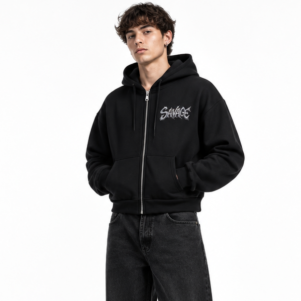 Male model wearing the black SAVAGE zip-up jacket in a white studio